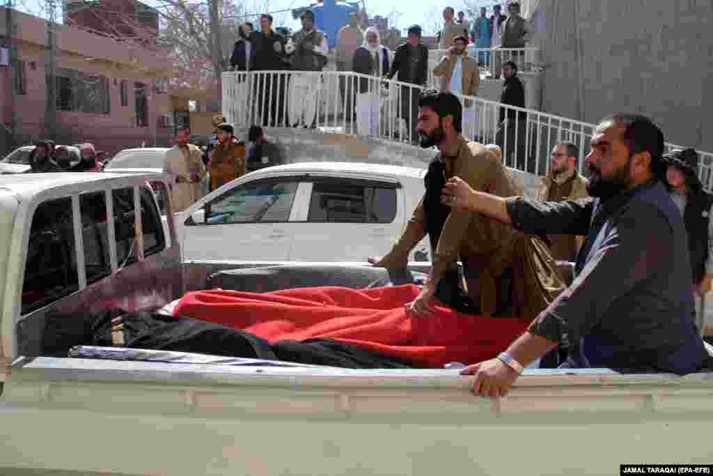 Onlookers watch as victims continue to arrive at the hospital in Quetta. The second blast occurred in Qilla Saifullah, near an office of Maulana Abdul Wasi, a candidate of Jamiat Ulema Islam (JUI), a religious party that has previously been the target of militant attacks, Yasir Baz, the head of the local administration, told the media.