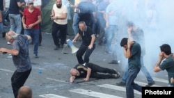 Armenia - A protester is injured in a stun grenade explosion, Yerevan, June 12, 2024.