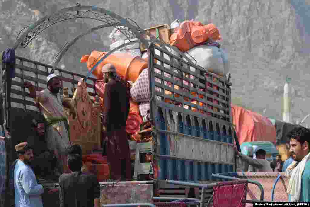 Afghan refugees wait to board trucks at the border crossing at Torkham. "Pakistan's announced deadline for Afghans to return has led to detentions, beatings, and extortion, leaving thousands of Afghans in fear over their future," said Fereshta Abbasi, HRW's Afghanistan researcher.
