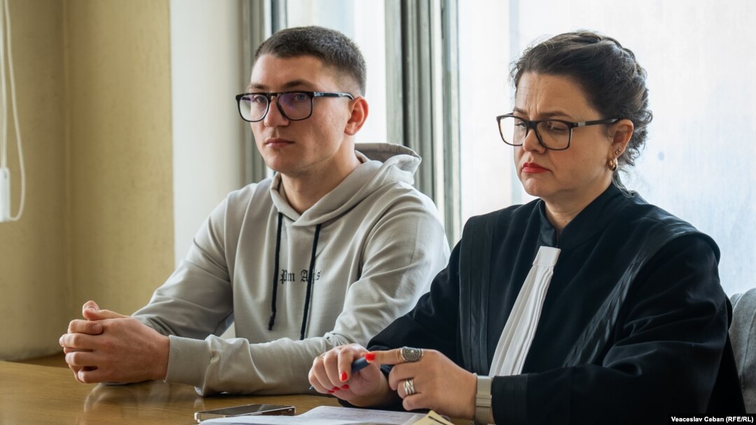 Marin Pavlescu attends a court session with his lawyer Doina Straisteanu in Chisinau on November 29.