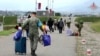 Nagorno-Karabakh - Russian peacekeepers help ethnic Armenian civilians to take shelter at their base near Stepanakert, September 21, 2023