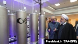 Iranian President Hassan Rohani (right) and the head of the country's atomic technology organisation Ali Akbar Salehi inspect a nuclear facility earlier this year.