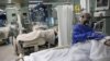 BULGARIA -- A medic tends to a coronavirus disease (COVID-19) patient at the intensive care unit (ICU) of Pirogov hospital in Sofia, Bulgaria, October 15, 2021. Picture taken October 15, 2021. REUTERS/Stoyan Nenov - RC28AQ9GFIK1