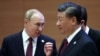 Орусиянын президенти Владимир Путин (солдо) Кытайдын лидери Си Цзинпин менен 2022-жылы сентябрь айында Самаркандда өткөн Шанхай Кызматташтык Уюмунун (ШКУ) саммитинде.