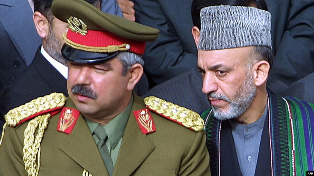 Hamid Karzai (right) with then Deputy Defense Minister General Abdul Rashid Dostum in March 2002.