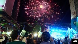People in Lahore watch fireworks to show solidarity with the Pakistan army on May 11,