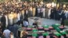 Coffins of those killed in a bomb attack on a Shi'ite mosque in Herat.