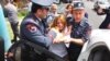 Полицейские с применением сил выводят оппозиционного кандидата в мэры Еревана Заруи Постанджян из штаба РПА в Аване, Ереван, 14 мая 2017 г․