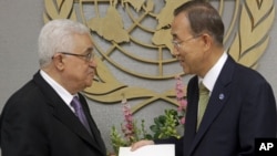 Palestinian leader Mahmud Abbas (left) delivers a letter requesting recognition of Palestine as a state to Secretary-General Ban Ki-moon during the 66th session of the General Assembly at United Nations headquarters in New York on September 23.