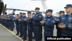 Armenian sappers, medical personnel, and others attend a ceremony at the Yerevan airport before traveling to Syria.