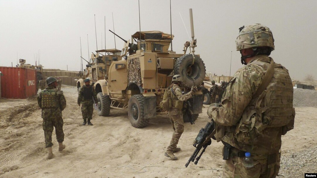 U.S. soldiers keep watch at the entrance of the U.S. base in Panjwai district of Kandahar Province.
