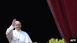 Pope Francis delivers his Easter blessing from the balcony of St Peter's Basilica in the Vatican on April 1.