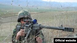 Nagorno-Karabakh -- A Karabakh Armenian soldier practices sniper fire during a military exercise.