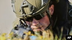 A Turkish Navy soldier takes part in a NATO exercises in Barbate, southern Spain, on March 25.