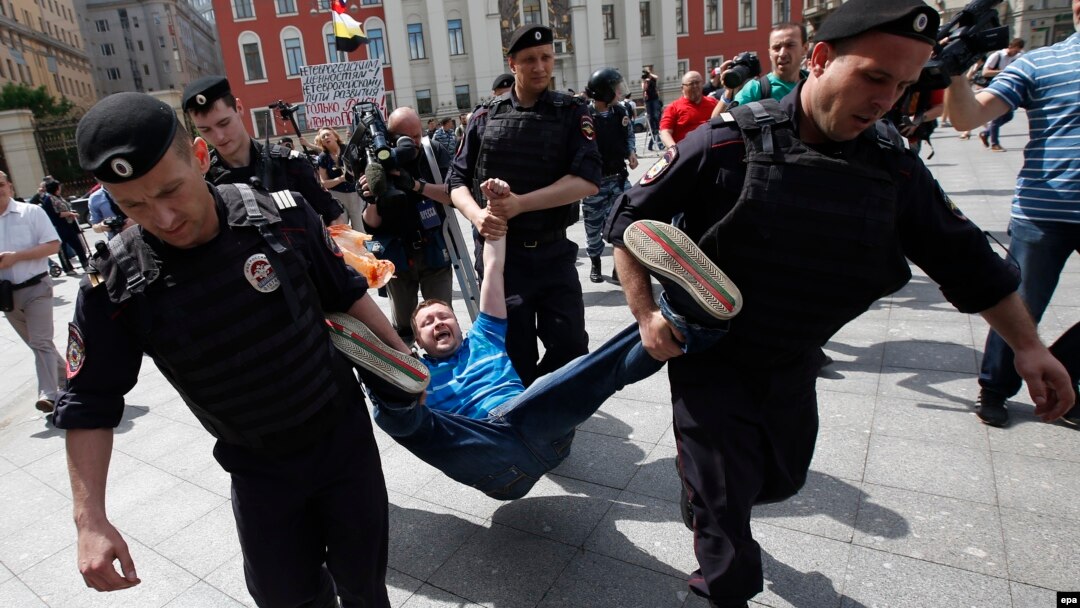 Police officers detain a protester in Moscow last year. According to Freedom House, 2015 saw Russia and other authoritarian regimes "crack down harder on dissent."
