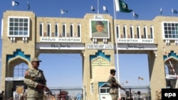 Pakistani paramilitary soldiers stand at a checkpoint in South Waziristan in October.