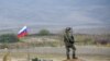 A Russian peacekeeper patrols at the check point outside Askeran in Nagorno-Karabakh (file photo).