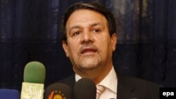 علی الدباغ سخنگوی دولت عراق، سفر احمدی نژاد را علت ناهماهنگی برای تنظیم زمان مذاکرات میان ایران و آمریکا ذکر کرد.( عکس: EPA)