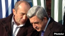 Armenia - President Serzh Sarkisian (R) and his predecessor Robert Kocharian at an official ceremony outside Yerevan, 1Dec2008.