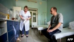 A patient waits to be treated in the toxicology unit in a hospital treating drug users in separatist-held Donetsk.