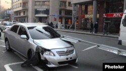 Armenia - A car damaged in an accident in downtown Yerevan.