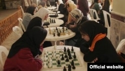 Afghan high school girls play chess during a tournament in Herat Province in 2010.