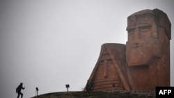Nagorno-Karabakh - A man walks towards the iconic statue "We Are Our Mountains" outside Stepanakert on November 12, 2020.