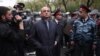 Armenia - Nerses Nazarian (C), chief of the Yerevan police, oversees riot police forces clashing with opposition protesters in Yerevan, 9Apr2013.