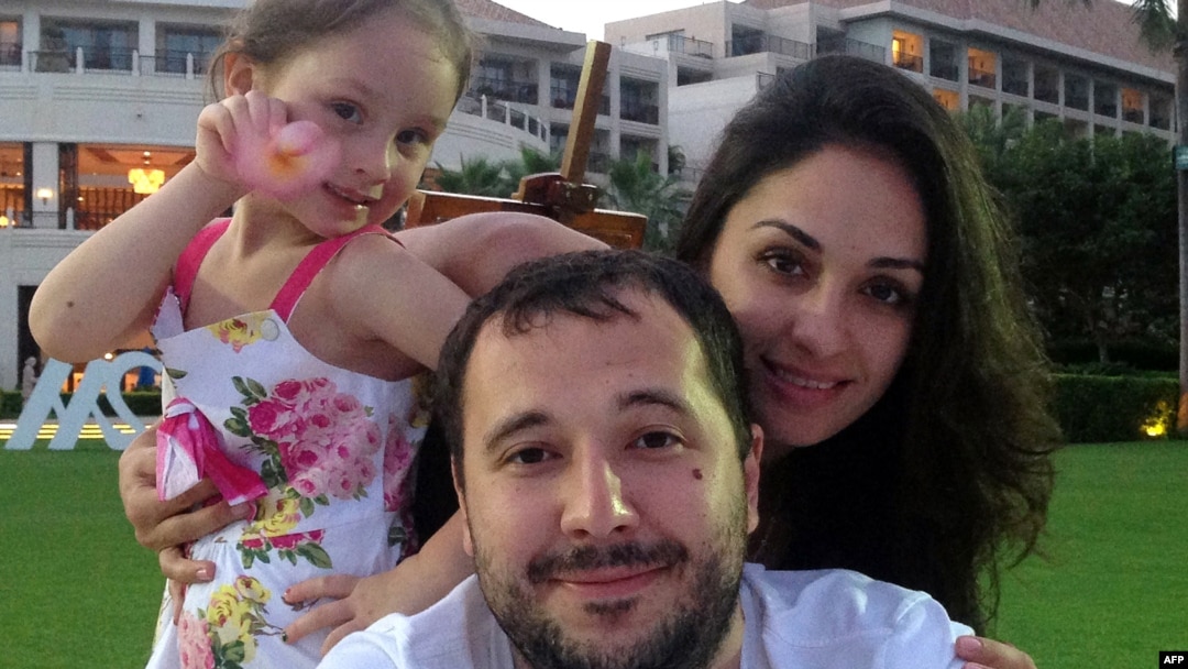 Roman Seleznyov (center), the son of a Russian lawmaker from the Liberal Democratic Party, poses with his partner Anna Otisko (right) and their daughter.