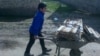 Uzbekistan - school boy is bringing a scrap metal to the school in Jizzakh city, 14 March 2015