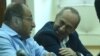 Armenia -- Former President Robert Kocharian (R) talks to his lawyer Hayk Alumian during his trial, Yerevan, October 7, 2019.