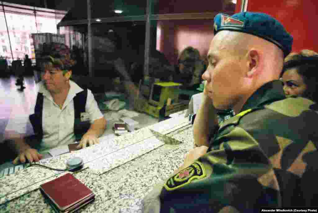 A soldier who has finished his military service receives a train ticket, paid for by the army, to return home.