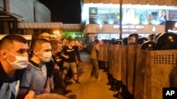Police block demonstrators during a rally after the Belarusian presidential election in Minsk on August 9