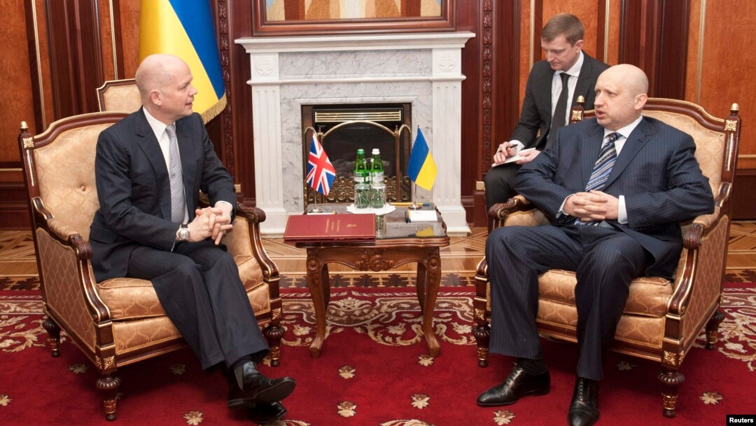 British Foreign Secretary William Hague (left) with acting Ukrainian President Oleksander Turchynov meet last month. 