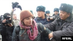 Police detain Maksim Kuleshov during a march in Bishkek in February 2008.