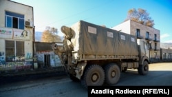NAGORNO-KARABAKH -- An Azeri military truck drives drives along a street in Hadrut town, November 25, 2020