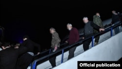 Armenia - Captives freed by Azerbaijan walk off a Russian plane at Yerevan's Erebuni airport, December 14, 2020