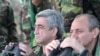 Armenia -- President Serzh Sarkisian (L) watches military exercises in Nagorno-Karabakh on October 22, 2009.