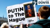 Halkara Adalat Kazyýetiniň binasynyň daşyndaky protestçiler Russiýanyň lideri Wladimir Putiniň tussag edilmegini talap etdiler. Haaga, Hollandiýa, 2024-nji ýylyň 7-nji maýy