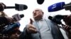 Armenia - Former Mayor Vartan Ghukasian speaks to journalists outside a polling station in Gyumri, March 30, 2025.